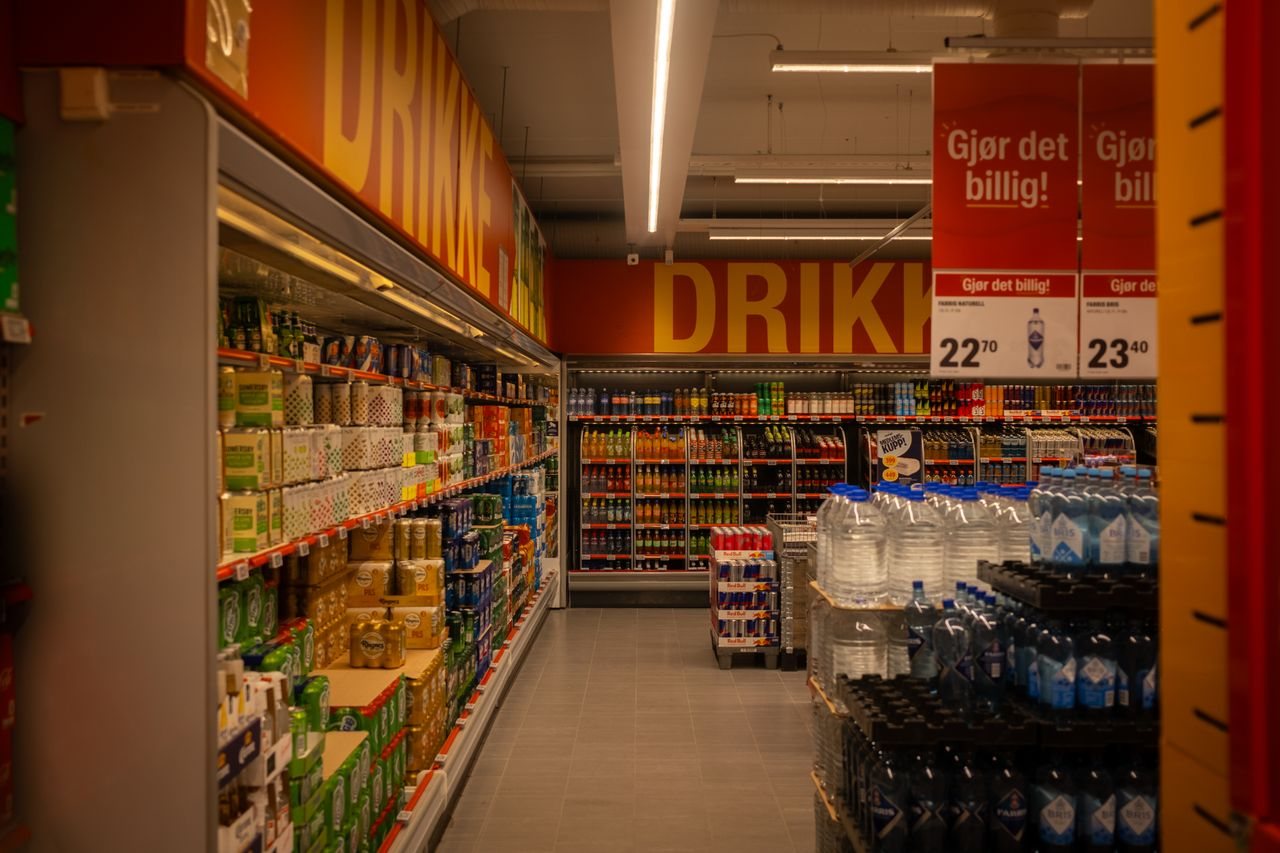 Free Colorful drink aisle in a supermarket with signage promoting deals. Stock Photo
